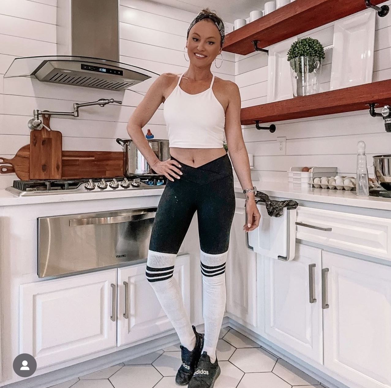 girl in kitchen cooking wearing thigh highs over leggings