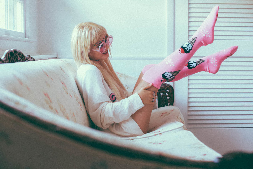 blonde with long tshirt and funky socks