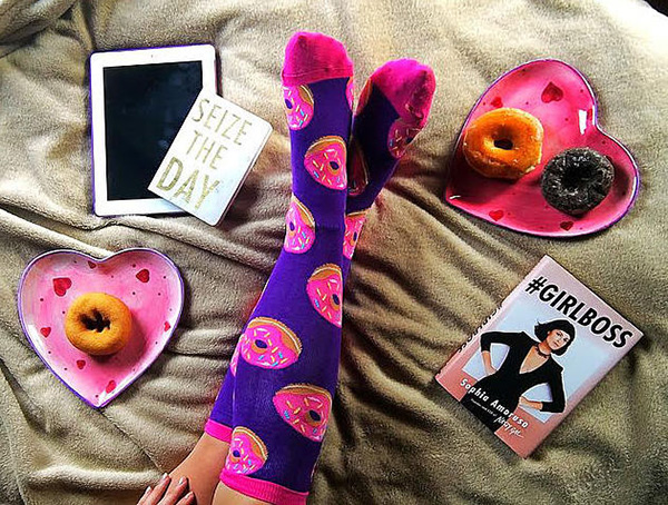 boss wearing funky donut socks remote